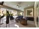 Comfortable covered patio with stylish furniture, ceiling fan, and views of the pool at 193 Elder View Dr, Las Vegas, NV 89138