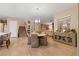 Bright dining area with stylish light fixture, adjacent to the living room and staircase at 193 Elder View Dr, Las Vegas, NV 89138