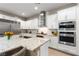 Chef's kitchen featuring granite counters, stainless steel appliances, and ample storage at 193 Elder View Dr, Las Vegas, NV 89138