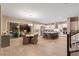 Modern kitchen and dining area with stainless steel appliances, island seating, and backyard views at 193 Elder View Dr, Las Vegas, NV 89138