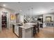Modern kitchen boasts stainless appliances, a kitchen island with seating, and a walk-in pantry at 193 Elder View Dr, Las Vegas, NV 89138