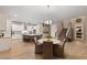 Open concept kitchen with a large island, stainless steel appliances, and stylish dining area at 193 Elder View Dr, Las Vegas, NV 89138