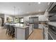 Gourmet kitchen features stainless appliances, a granite countertop island, and an open layout at 193 Elder View Dr, Las Vegas, NV 89138