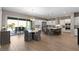 Open-concept kitchen with stainless appliances, large island, and seamless flow to the outdoor living area at 193 Elder View Dr, Las Vegas, NV 89138