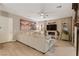 Bright living room features a comfortable sofa, fireplace, and a flat screen television for modern living at 193 Elder View Dr, Las Vegas, NV 89138