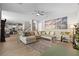 Open-concept living room with tile floors, a ceiling fan, and views into the kitchen at 193 Elder View Dr, Las Vegas, NV 89138