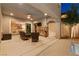 Cozy outdoor living space with a stone fireplace and comfortable seating, extending living outdoors at 193 Elder View Dr, Las Vegas, NV 89138