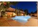 Stunning backyard pool and spa with elegant fire bowls and tasteful landscaping for relaxation at 193 Elder View Dr, Las Vegas, NV 89138