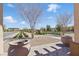 Attractive street view with decorative landscaping, mature trees, and a glimpse of neighborhood homes at 193 Elder View Dr, Las Vegas, NV 89138