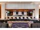 Elegant bar with ample seating, mirrored back, and televisions for entertainment at 2000 Fashion Show Dr # 5300, Las Vegas, NV 89109