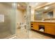 Bathroom featuring double vanity with large mirror, a glass shower and toilet at 2000 Fashion Show Dr # 5300, Las Vegas, NV 89109