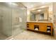 Bathroom featuring double vanity with large mirror, a glass shower, and soaking tub with tile surround at 2000 Fashion Show Dr # 5300, Las Vegas, NV 89109