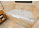 Bathroom features a large soaking tub with tile surround and grab bar at 2000 Fashion Show Dr # 5300, Las Vegas, NV 89109