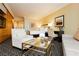 Bedroom boasts a sitting area, kitchenette, and geometric patterned carpet at 2000 Fashion Show Dr # 5300, Las Vegas, NV 89109
