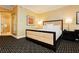 Well-appointed bedroom with a comfortable bed, a sleek headboard, and geometric patterned carpeting at 2000 Fashion Show Dr # 5300, Las Vegas, NV 89109
