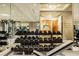 Contemporary gym featuring an extensive array of free weights, machines and mirrors in a wellness space at 2000 Fashion Show Dr # 5300, Las Vegas, NV 89109