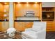 Living area featuring a kitchenette with modern appliances, comfortable chair, and glass coffee table at 2000 Fashion Show Dr # 5300, Las Vegas, NV 89109
