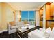 Living room features a sofa, chair, large windows and a bar at 2000 Fashion Show Dr # 5300, Las Vegas, NV 89109
