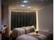 Serene spa room with two massage beds and ambient lighting for a relaxing experience at 2000 Fashion Show Dr # 5300, Las Vegas, NV 89109