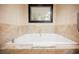 Close-up of elegant bathtub with tile surround and contemporary fixtures at 2000 N Fashion Show Dr # 4301, Las Vegas, NV 89109