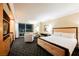 Hotel bedroom suite with king bed and sitting area overlooking city lights at 2000 N Fashion Show Dr # 4301, Las Vegas, NV 89109