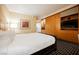Comfortable hotel bedroom with king bed, wood accents and built-in storage at 2000 N Fashion Show Dr # 4301, Las Vegas, NV 89109
