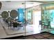 Hotel dining area with glass partitions and minimalist decor featuring square tables and comfortable chairs at 2000 N Fashion Show Dr # 4301, Las Vegas, NV 89109