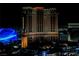Illuminated Palazzo Hotel facade at night with lights adding to its grand appearance at 2000 N Fashion Show Dr # 4301, Las Vegas, NV 89109