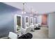 Contemporary salon setting with pendant lighting, white chairs, and plenty of mirrors creating a modern look at 2000 N Fashion Show Dr # 4301, Las Vegas, NV 89109