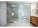 Bathroom featuring a glass enclosed shower and double sink vanity with marble countertops and plenty of storage at 2000 N Fashion Show Dr # 4302, Las Vegas, NV 89109