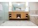 Bright bathroom with a double sink vanity, marble countertop, and a large, decorative mirror at 2000 N Fashion Show Dr # 4302, Las Vegas, NV 89109