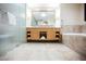 A bathroom with a double vanity, soaking tub, shower and tiled floor at 2000 N Fashion Show Dr # 4302, Las Vegas, NV 89109