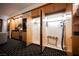 A closet with hangers, an ironing board, a luggage rack, and built-in storage at 2000 N Fashion Show Dr # 4302, Las Vegas, NV 89109