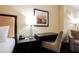 A home office desk with a lamp and phone at 2000 N Fashion Show Dr # 4302, Las Vegas, NV 89109