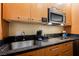 Detailed shot of a kitchenette countertop with modern fixtures and stainless steel microwave at 2000 N Fashion Show Dr # 4302, Las Vegas, NV 89109