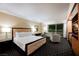 Comfortable hotel suite with a king-size bed, sitting area, and a view of the Las Vegas Strip at 2000 N Fashion Show Dr # 4302, Las Vegas, NV 89109