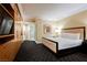 Inviting hotel suite featuring a cozy king-size bed and full bathroom with shower and mirror at 2000 N Fashion Show Dr # 4302, Las Vegas, NV 89109