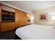 Well-lit hotel room with a comfortable king-size bed and storage cabinets with TV at 2000 N Fashion Show Dr # 4302, Las Vegas, NV 89109