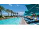 Large swimming pool with palm trees and lounge chairs by the poolside at 2000 N Fashion Show Dr # 4302, Las Vegas, NV 89109