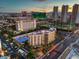 Beautiful aerial view of property, showing pool, city view, and tennis courts in the background at 205 E Harmon Ave # 1007, Las Vegas, NV 89169