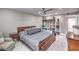 The bedroom features a bookshelf, ceiling fan, and modern decor at 205 E Harmon Ave # 1007, Las Vegas, NV 89169