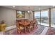 Elegant dining area featuring seating for six and a balcony with a view of the city at 205 E Harmon Ave # 1007, Las Vegas, NV 89169