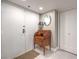 Hallway with a small wooden desk and decor, including a mirror at 205 E Harmon Ave # 1007, Las Vegas, NV 89169