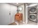 Hallway with a small wooden desk, decor, and laundry appliances at 205 E Harmon Ave # 1007, Las Vegas, NV 89169