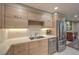 Modern kitchenette featuring stainless steel appliances and sleek countertops at 205 E Harmon Ave # 1007, Las Vegas, NV 89169