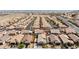 Expansive aerial view showcases a neighborhood with single-Gathering homes and well-maintained landscaping at 2091 Hunt Woods Ct, Laughlin, NV 89029