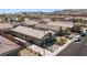 An aerial view displays the layout of the backyard and the single-story home nestled in a community at 2091 Hunt Woods Ct, Laughlin, NV 89029