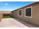 View of the backyard showcasing the concrete patio and artificial turf at 2091 Hunt Woods Ct, Laughlin, NV 89029