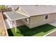 Aerial backyard view features a patio cover, hardscape, and turf lawn at 2091 Hunt Woods Ct, Laughlin, NV 89029
