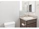 This is a bathroom with granite counters, and a view to a bedroom at 2091 Hunt Woods Ct, Laughlin, NV 89029